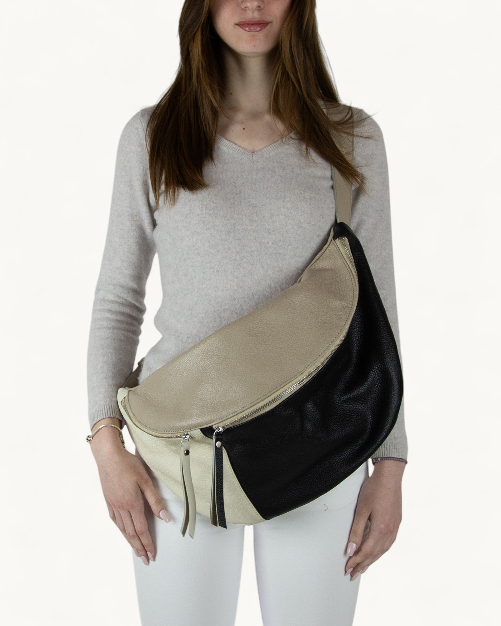 Woman wearing a two-tone black and white fanny pack