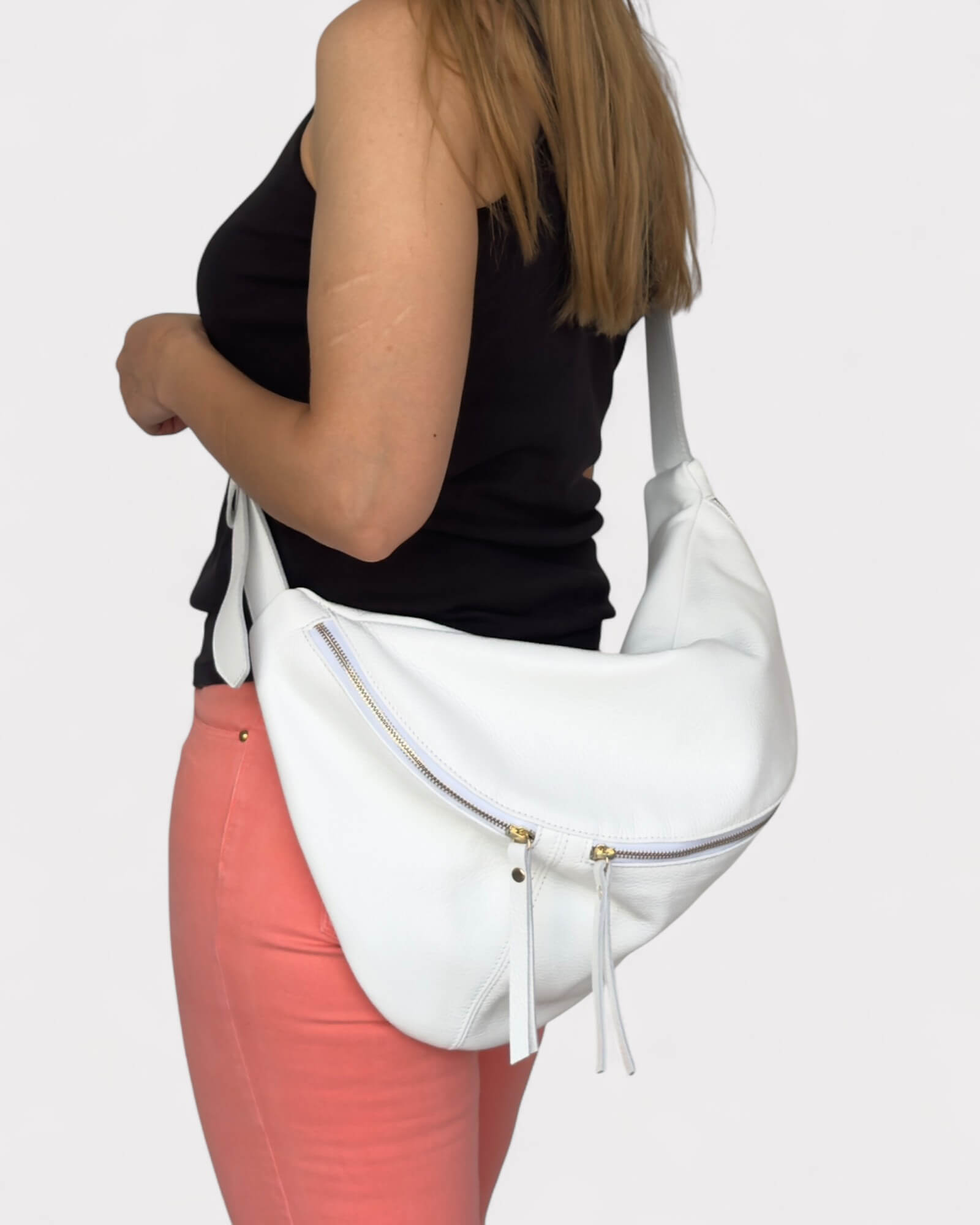 Model wearing a fanny pack on a light gray background