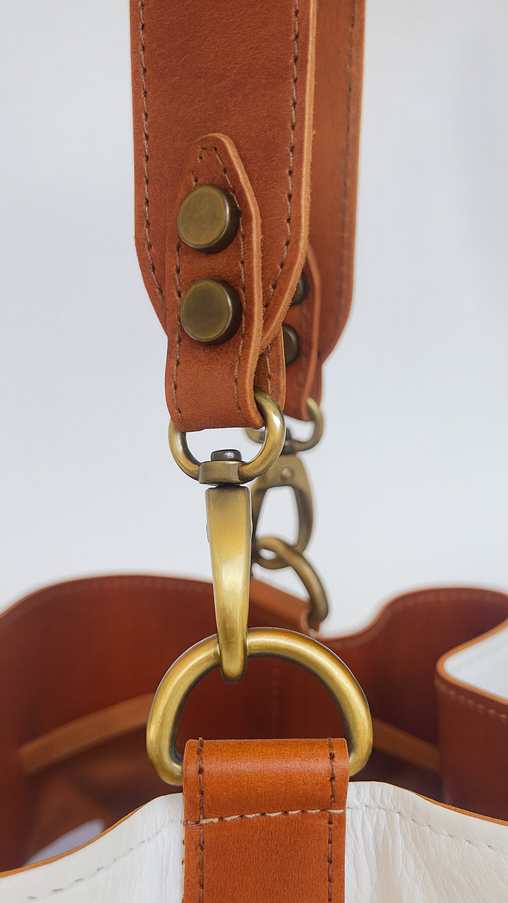detail image of strap of white bucket bag