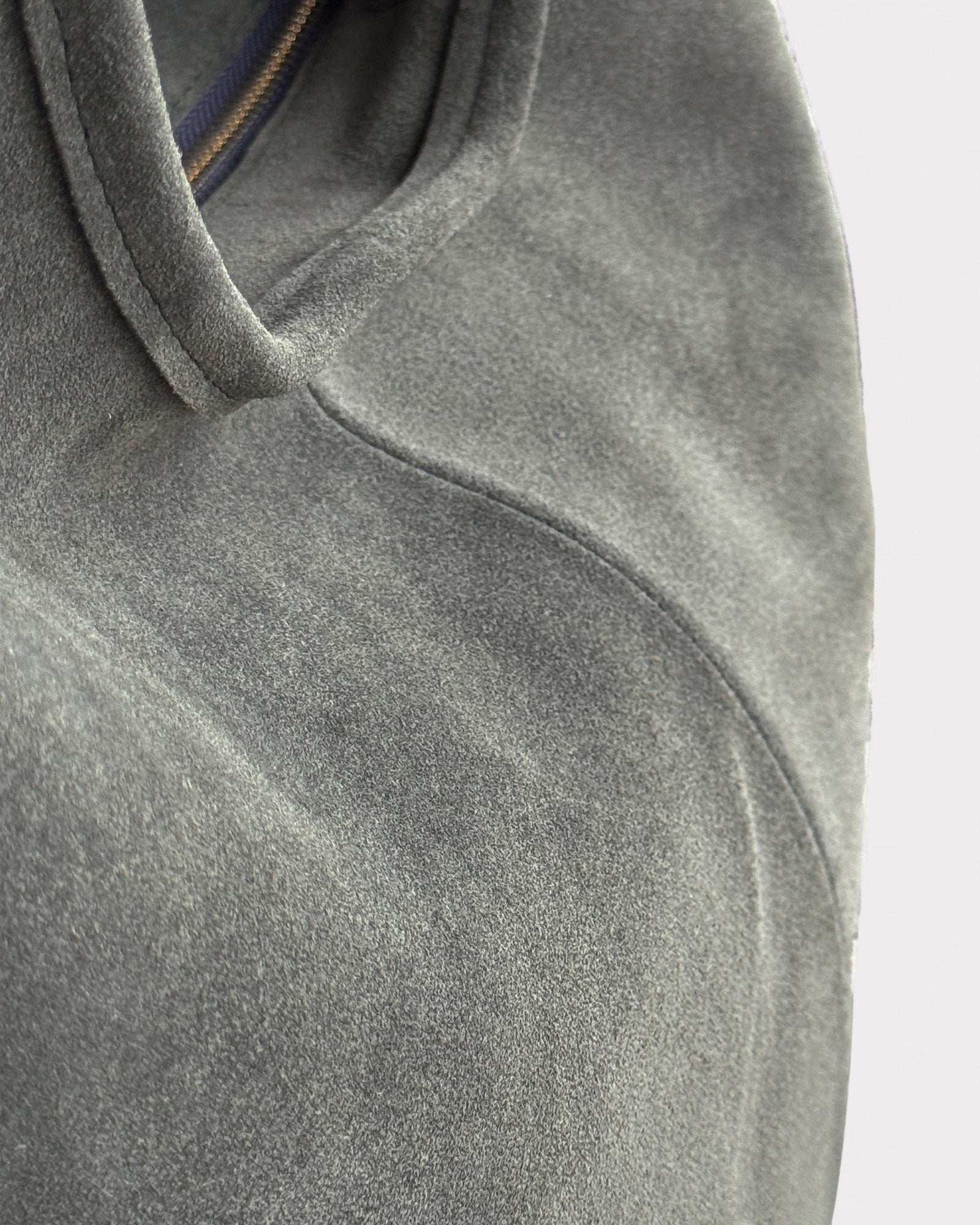 detail of suede leather green shoulder bag