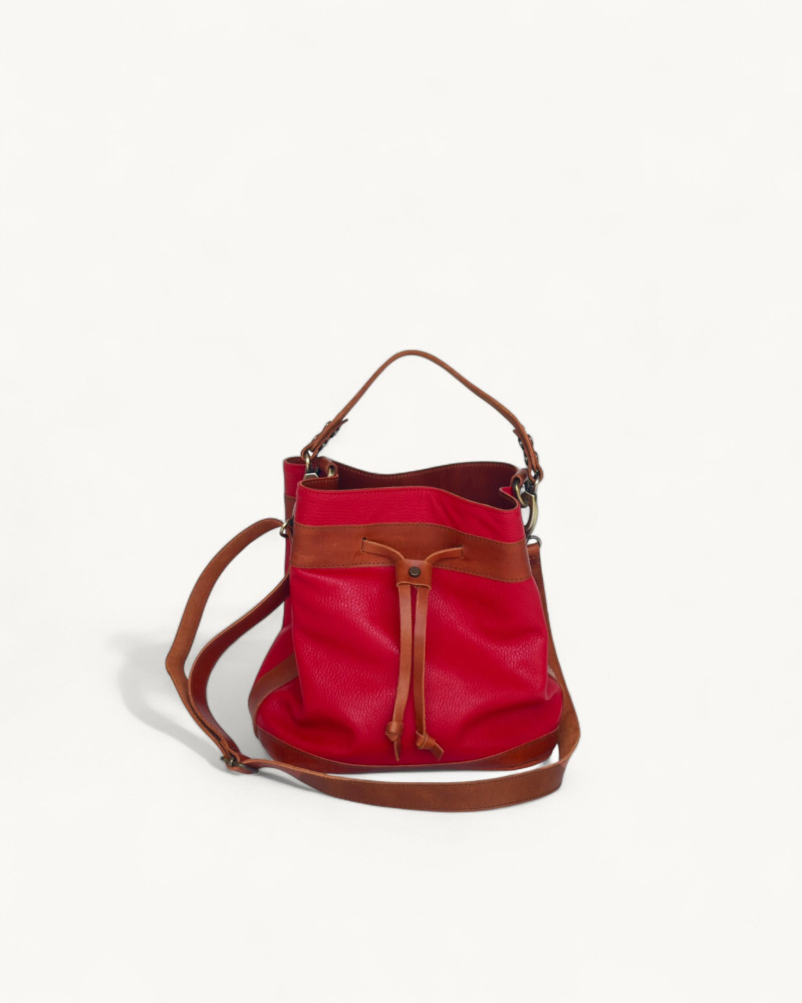 Red bucket with brown accents on a white background