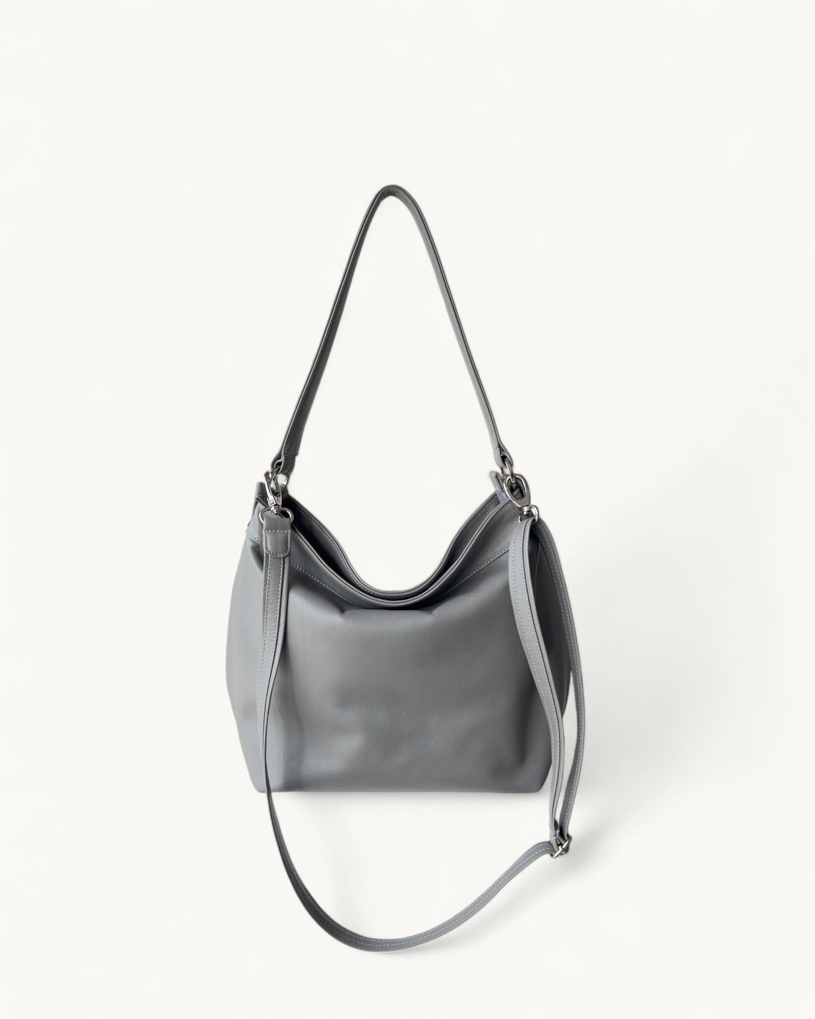 Gray handbag with a strap on a white background