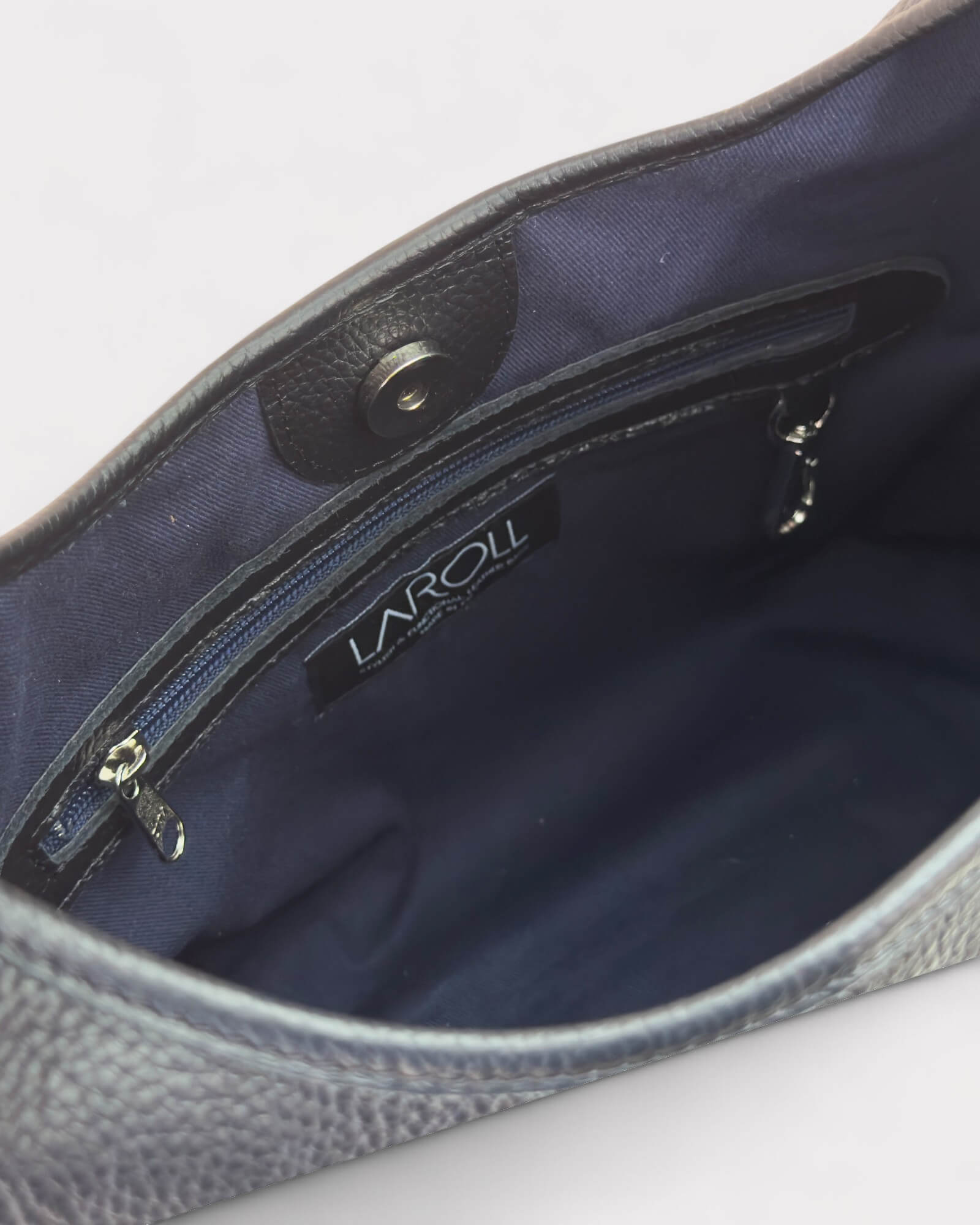 interior lining of a black leather shoulder bag