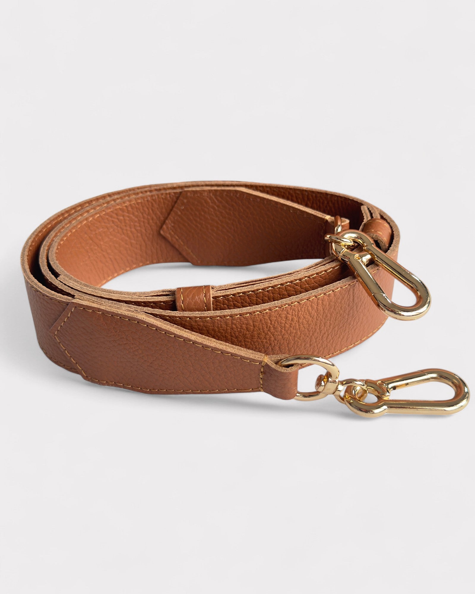 strap of tan camerabag