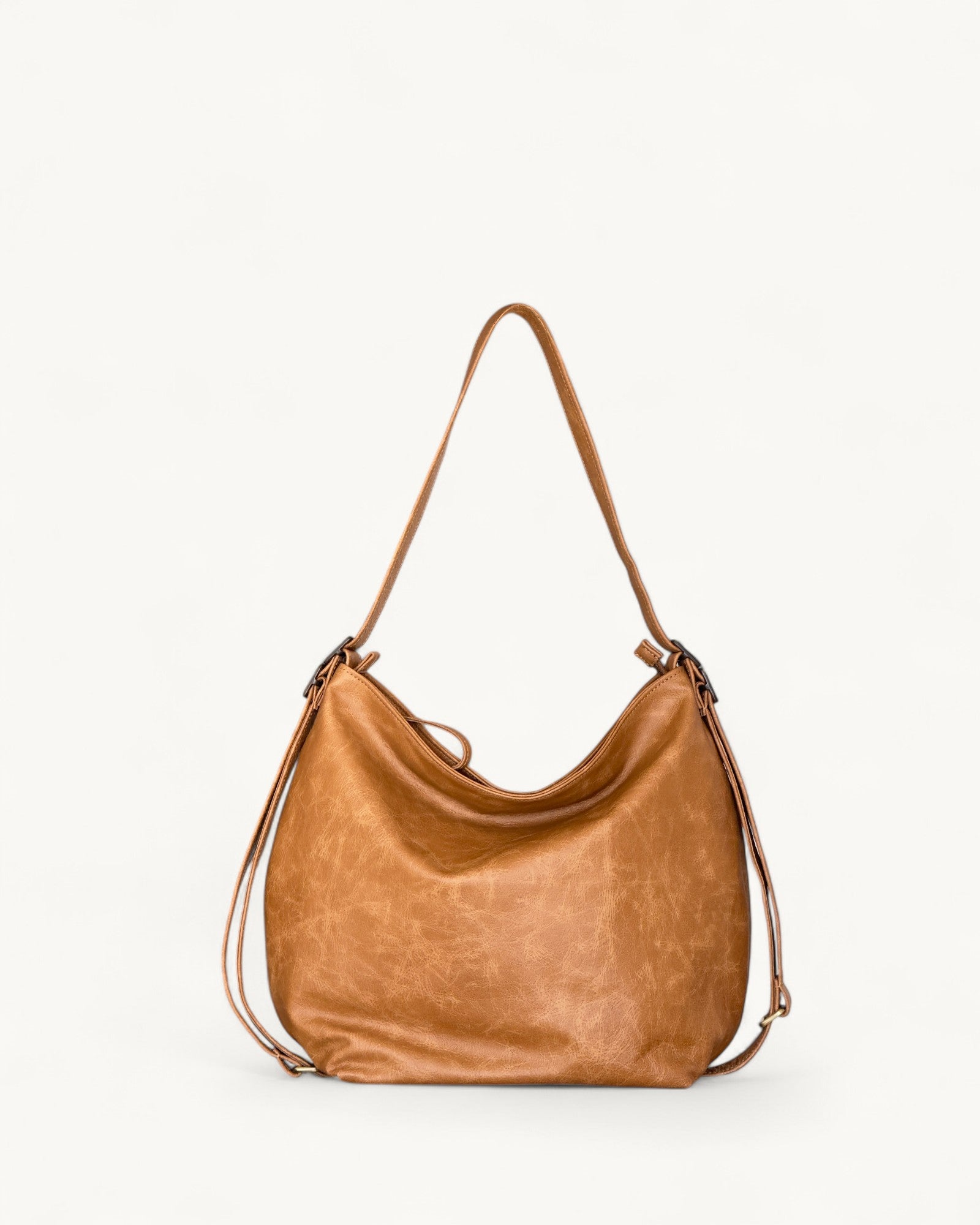 Tan leather handbag on a white background