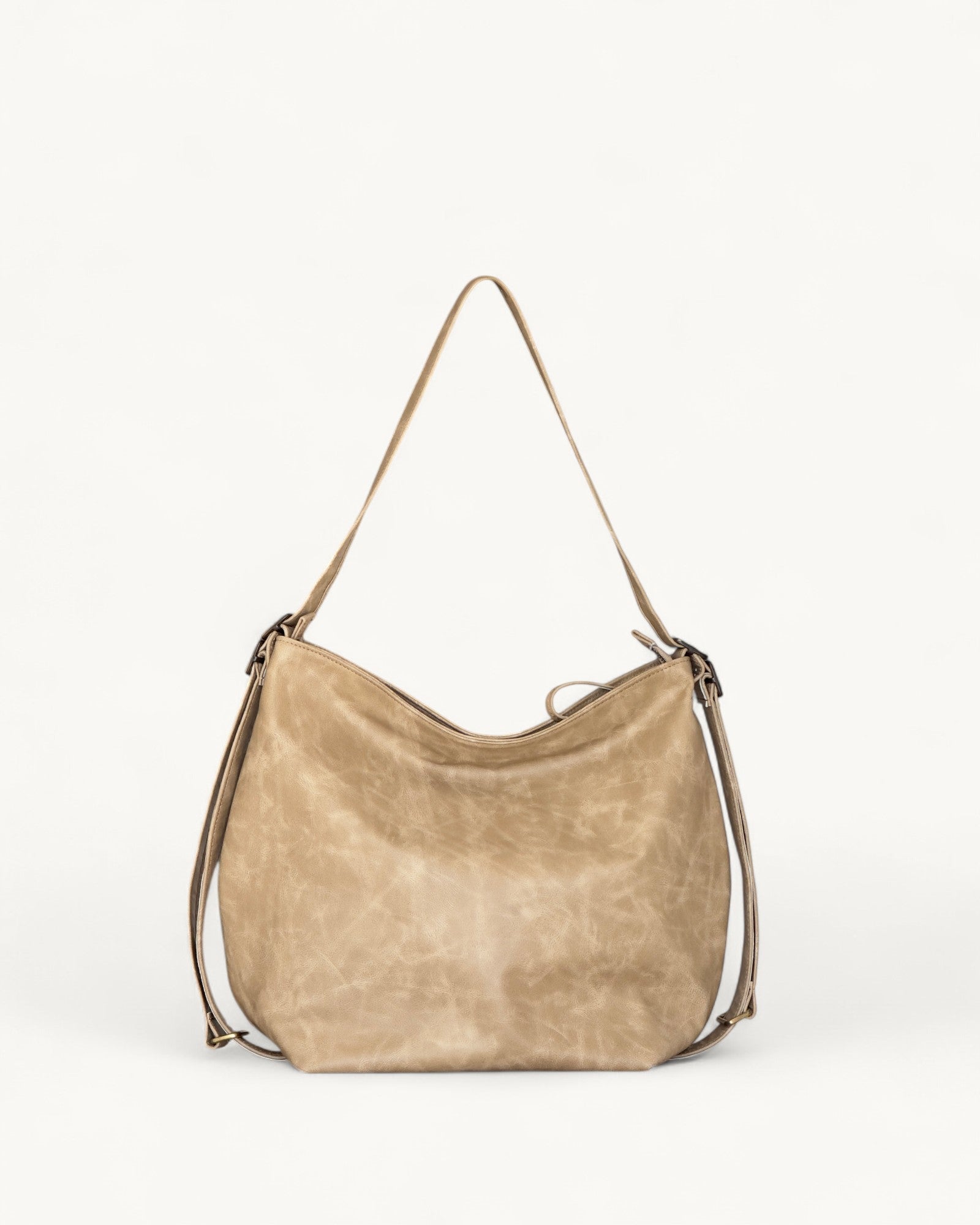Beige handbag with a shoulder strap on a white background