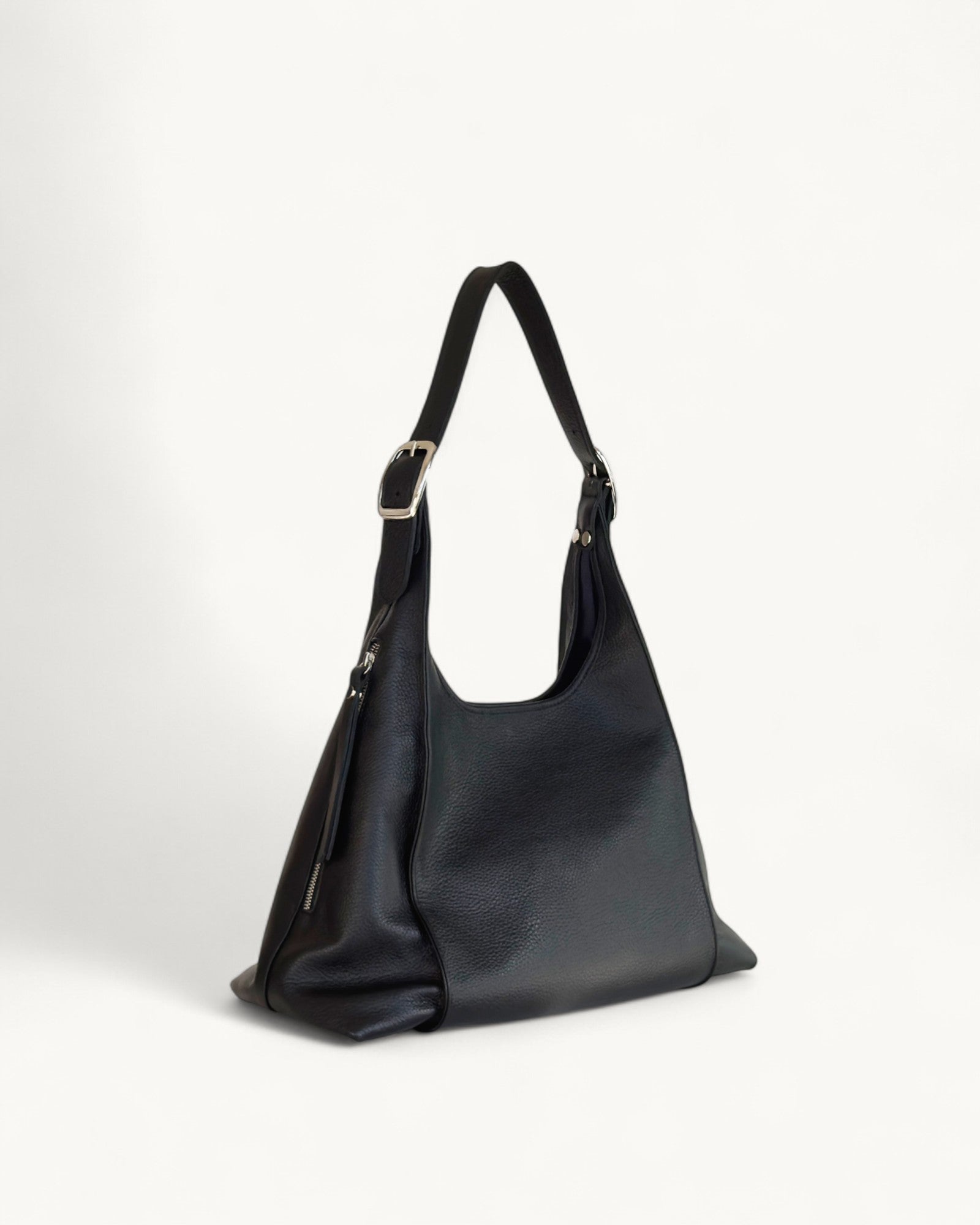 Black leather handbag on a white background