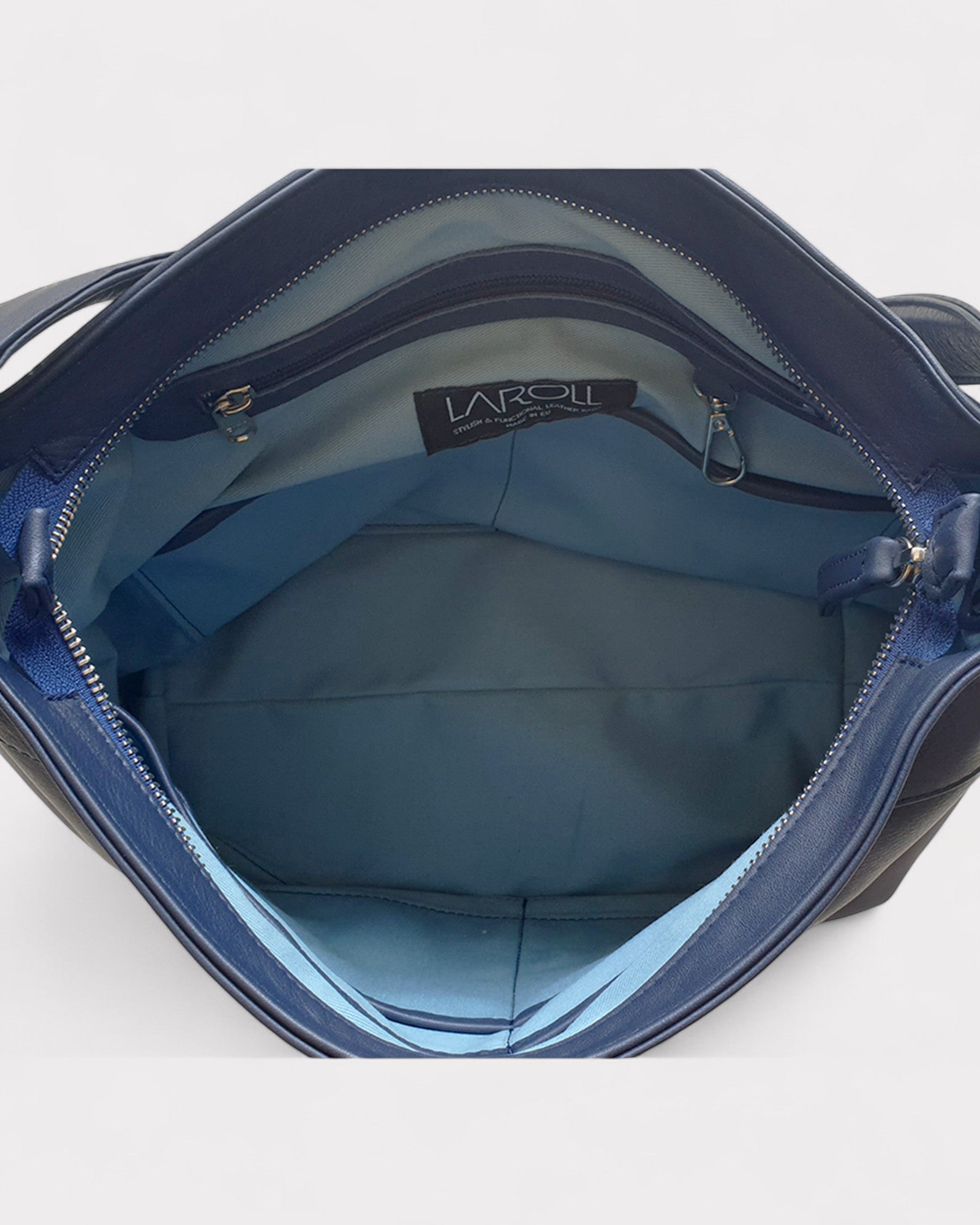 Blue handbag with visible brand logo on a white background