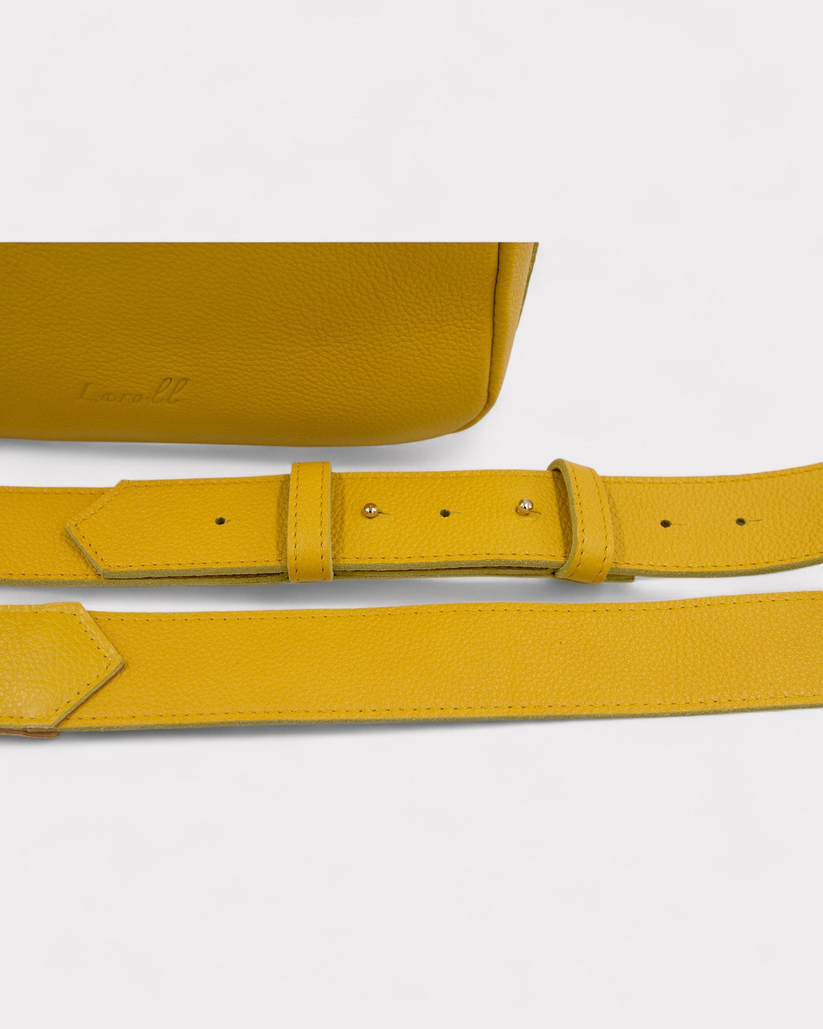 detail of strap of yellow camera bag