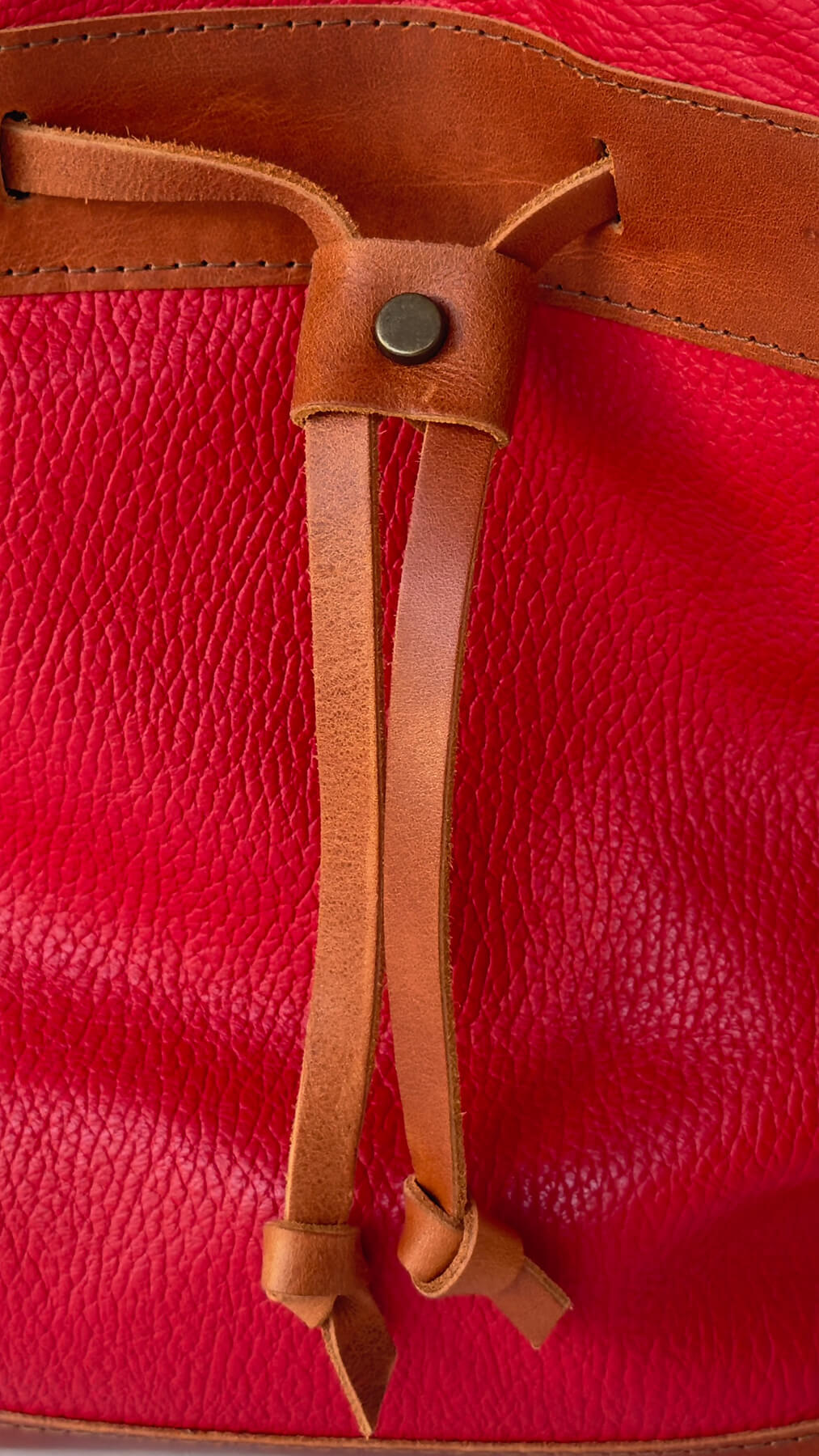 detail of the red bucket bag
