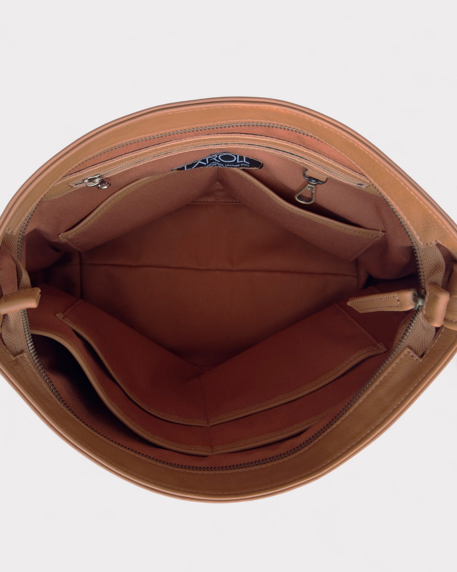 Tan leather bag with a visible brand logo on a white background