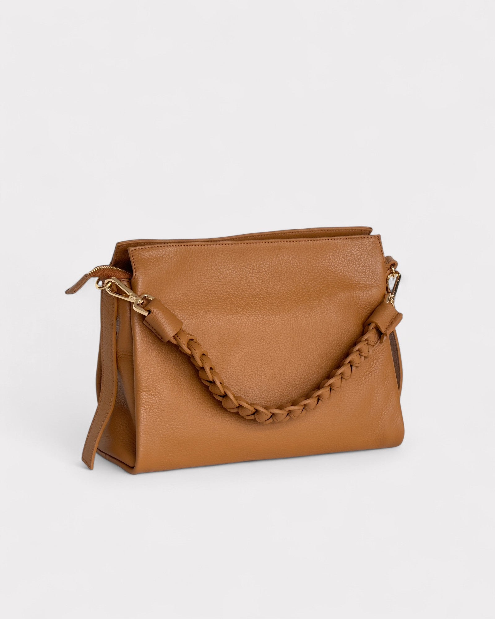 Tan handbag with a chain detail on a light gray background